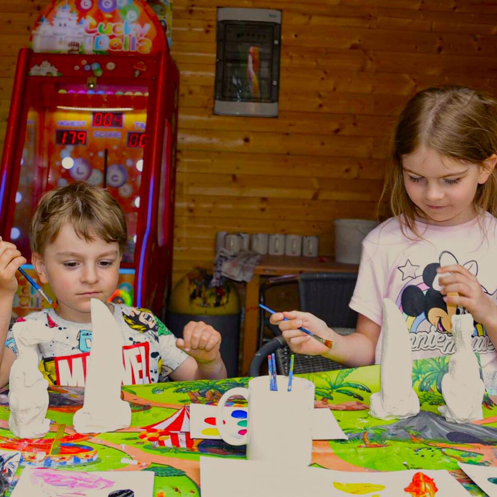 Picture of the children's plaster workshop painting station for casting dinosaur teeth in Styrassic Park